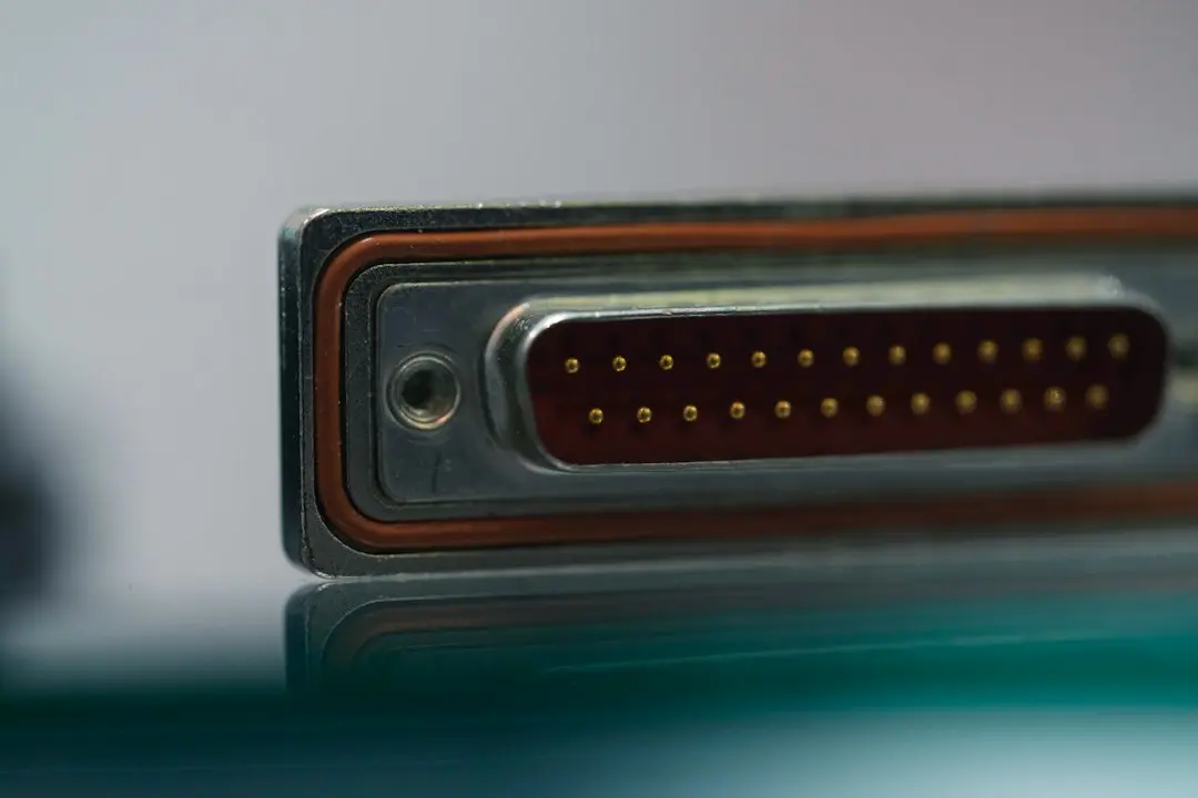 A close-up of a cable connector on the back of a device.